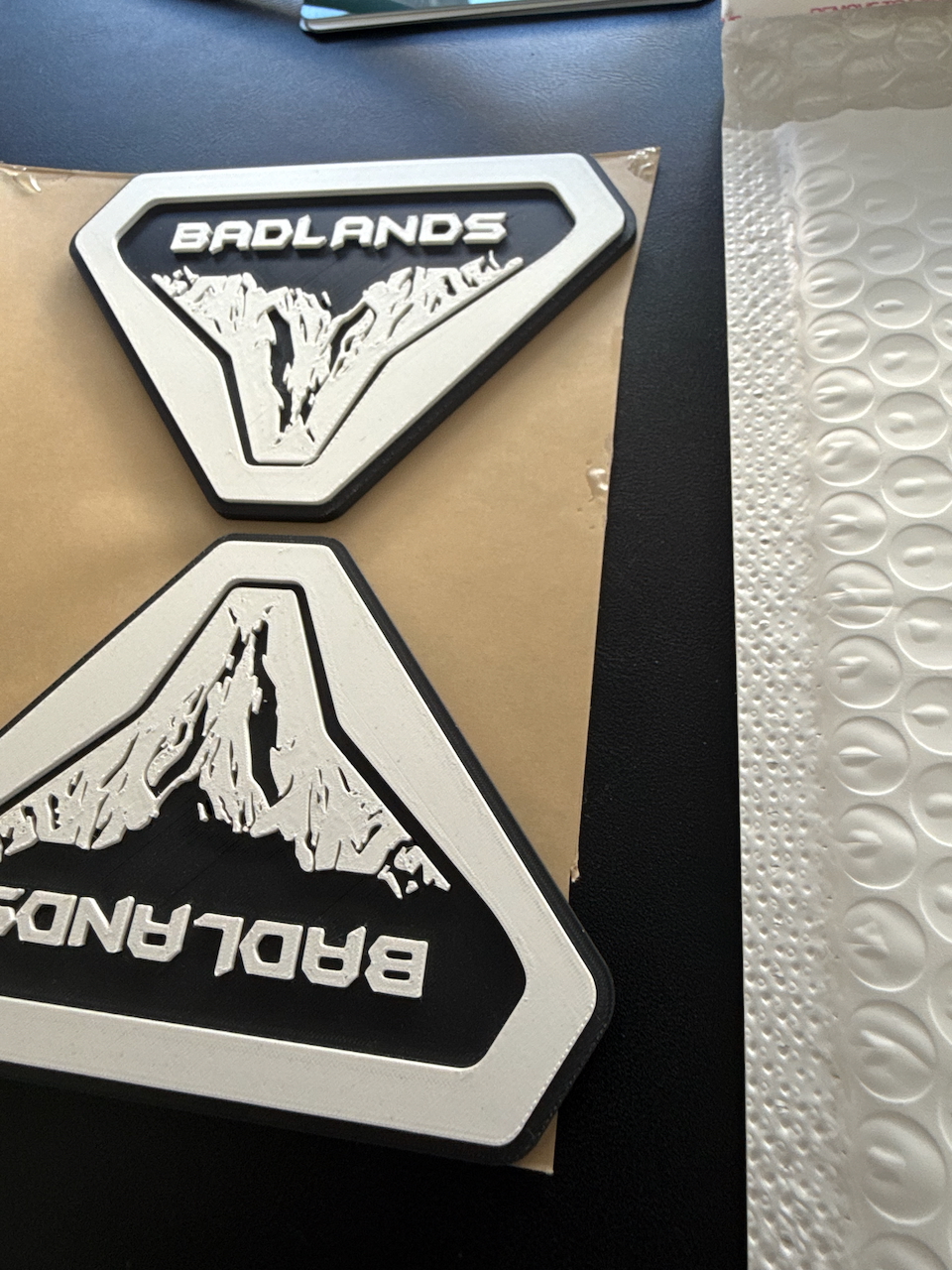 Red and black Badlands Sasquatch custom 3D printed badge